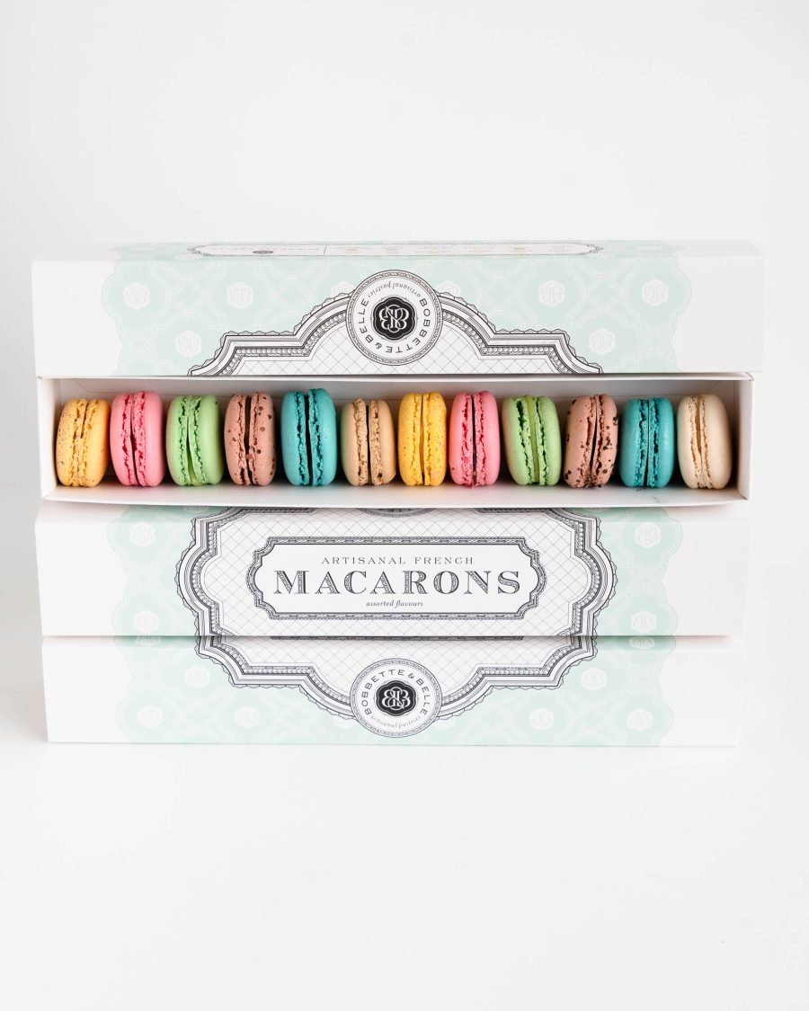 French Macaron 12 piece 2 Box of 12 assorted French macarons in pastel colours in elegant packaging on a clean background