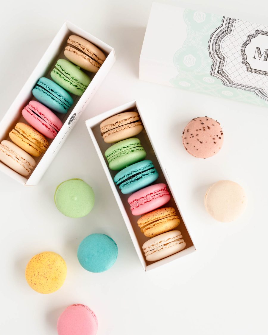 French Macaron 6 piece box Assorted pastel French macarons in gift boxes with colourful flavours displayed on a clean white background